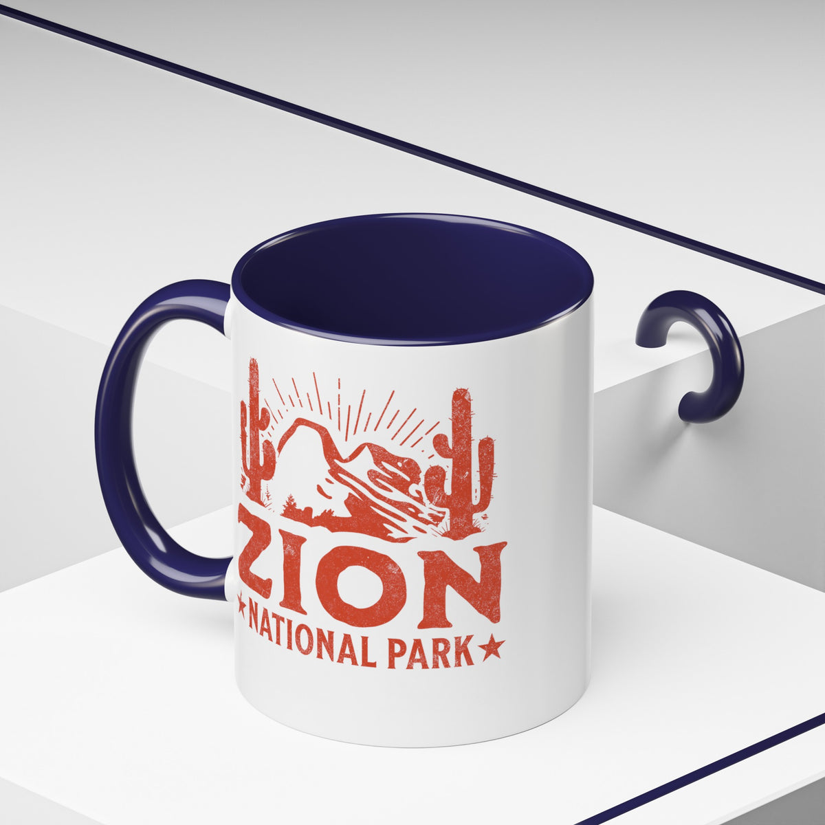 11 oz ceramic mug with navy contrasting handle featuring a cactus design of Zion National Park, perfect as a souvenir.