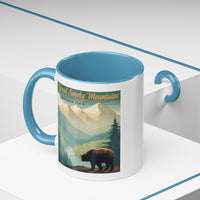 11 oz light blue ceramic mug featuring an illustration of a bear in Great Smoky Mountains National Park with mountains and trees in the background.