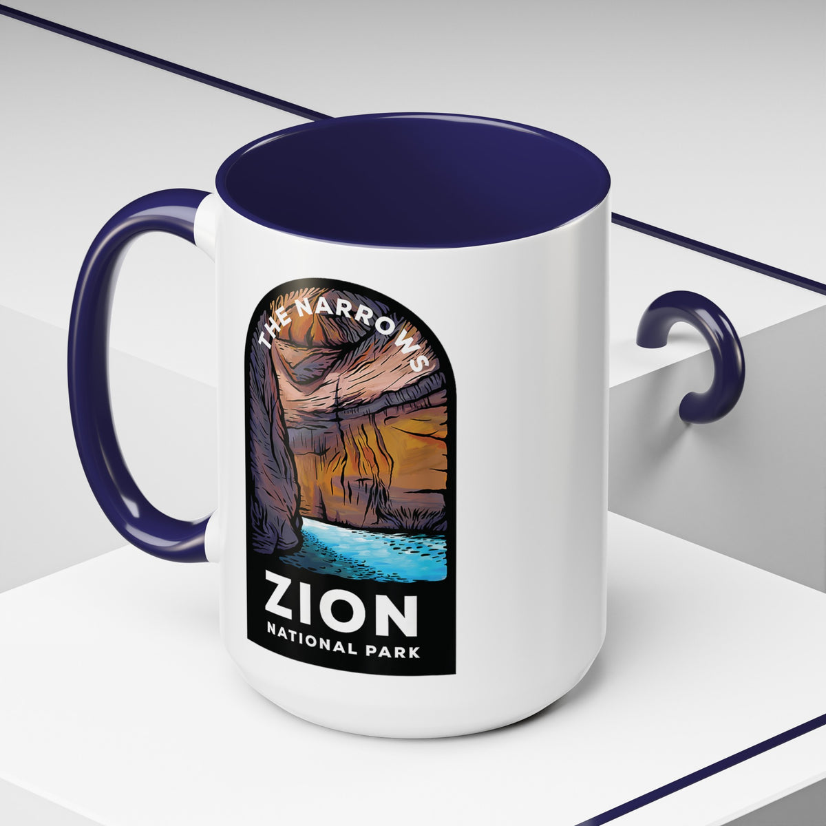 15 oz ceramic mug with navy contrasting handle featuring a design of The Narrows at Zion National Park, perfect as a souvenir.