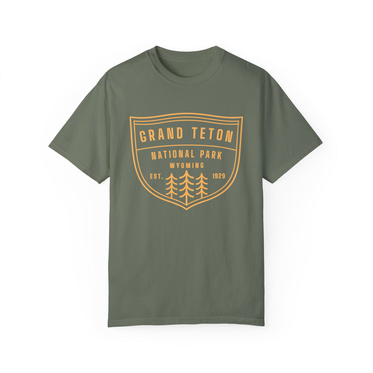 Grand Teton National Park T-shirt featuring a shield graphic design with trees and "Est. 1929 Wyoming" text.