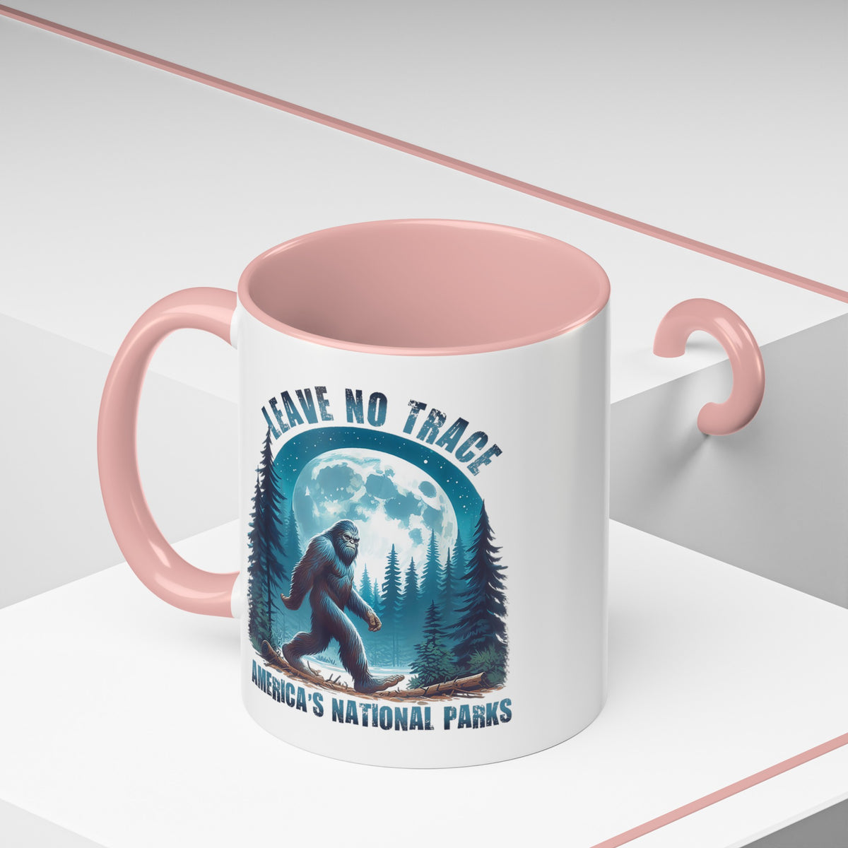 11 oz pink ceramic mug with Bigfoot graphic and "Leave No Trace" text, featuring Yosemite National Park scenery.