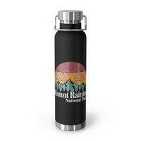 Stainless steel water bottle featuring a Mount Rainier National Park design with a sunset and mountain illustration, durable powder-coated finish.