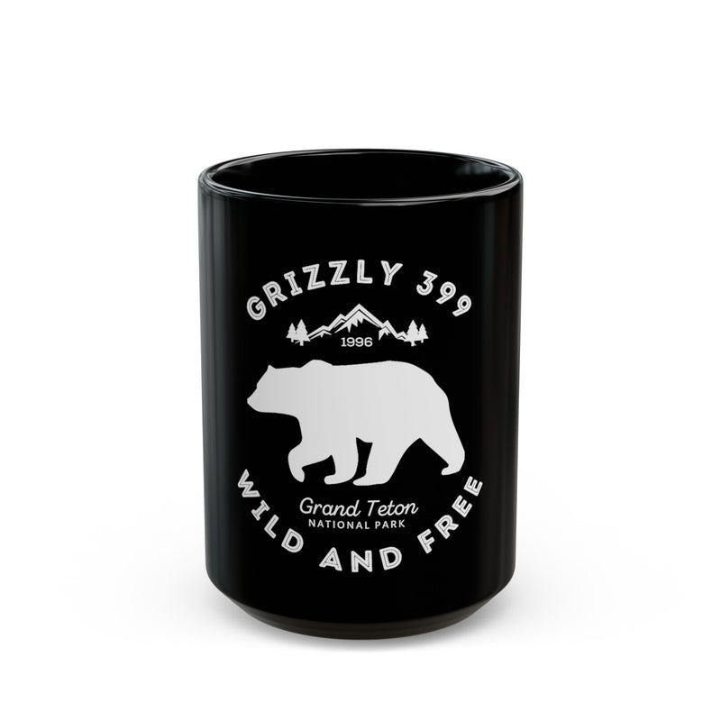 Grand Teton National Park souvenir mug featuring a Grizzly 399 design with "Wild and Free" text.