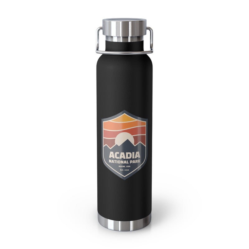 Stainless steel water bottle featuring an Acadia National Park design with a sunset badge illustration, durable powder-coated finish.