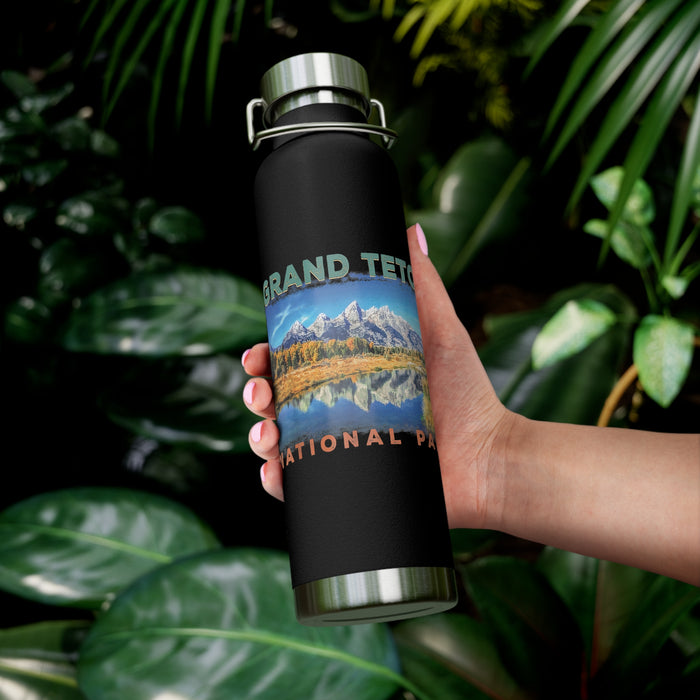 Grand Teton National Park souvenir water bottle featuring a scenic mountain reflection design with stainless steel construction.