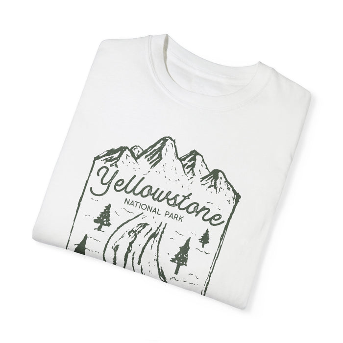 T-shirt featuring a scenic design of Yellowstone National Park with mountains, trees, and a geyser.