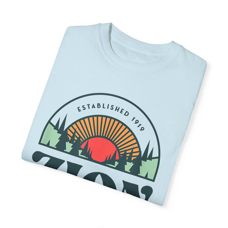 T-shirt featuring a scenic design with the text "Zion National Park" and a sunset graphic.