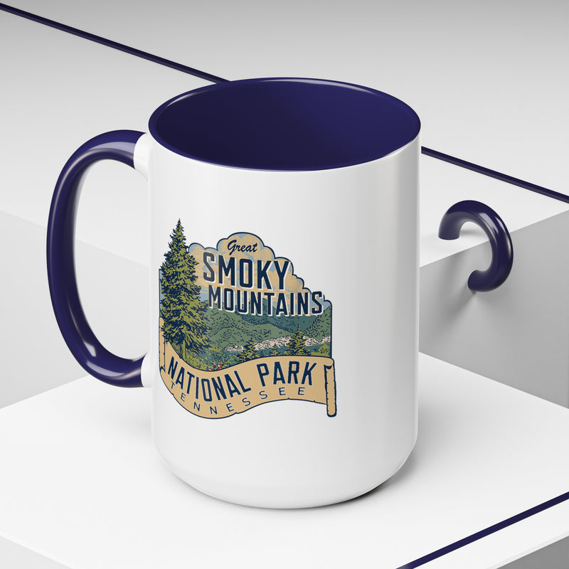 15 oz navy ceramic mug featuring an illustration of Great Smoky Mountains National Park with a scenic view and trees, labeled Tennessee.