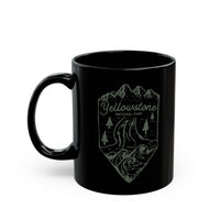 Black ceramic mug featuring a minimalist design of Yellowstone National Park with mountains, trees, and a river.