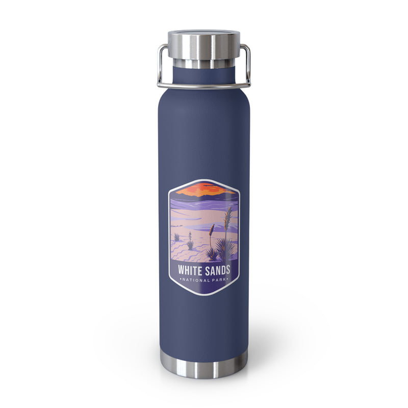 Navy stainless steel water bottle featuring a design of White Sands National Park with desert and sunset scenery.