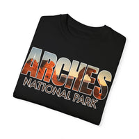 T-shirt featuring the text "Arches National Park" with scenic images of the park filling the letters.