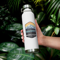 White stainless steel water bottle featuring a design of Wrangell-St. Elias National Park with mountain and sunset scenery.