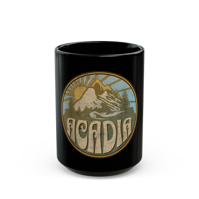 Black ceramic mug featuring a design of Acadia National Park with mountains and a sun graphic.