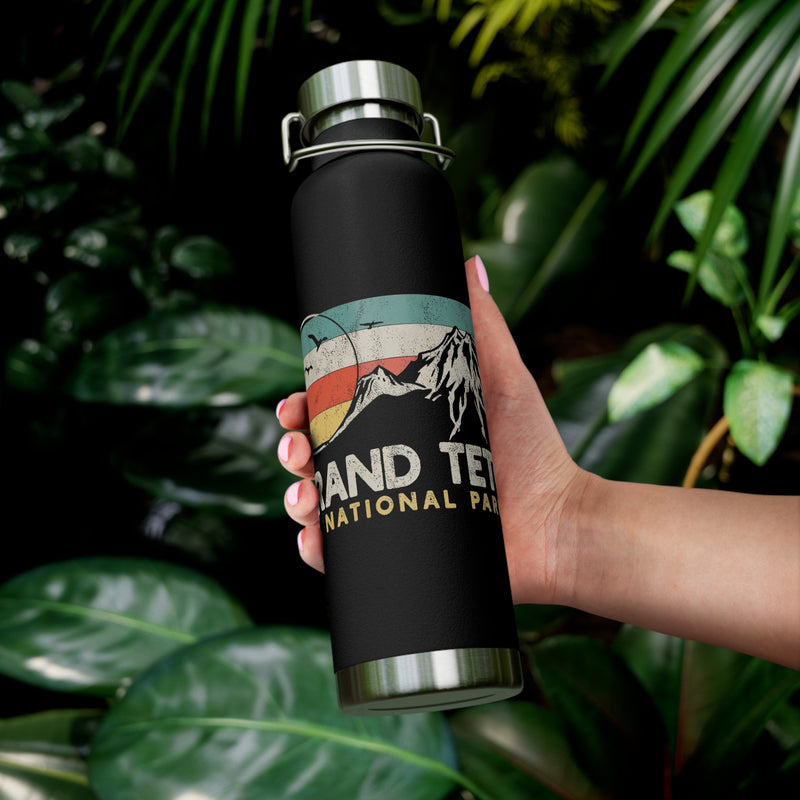 Grand Teton National Park souvenir water bottle featuring a mountain scene design with stainless steel construction.