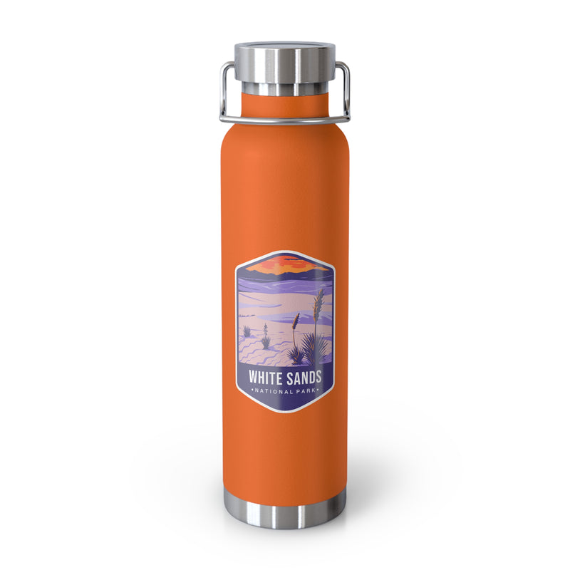 Orange stainless steel water bottle featuring a design of White Sands National Park with desert and sunset scenery.