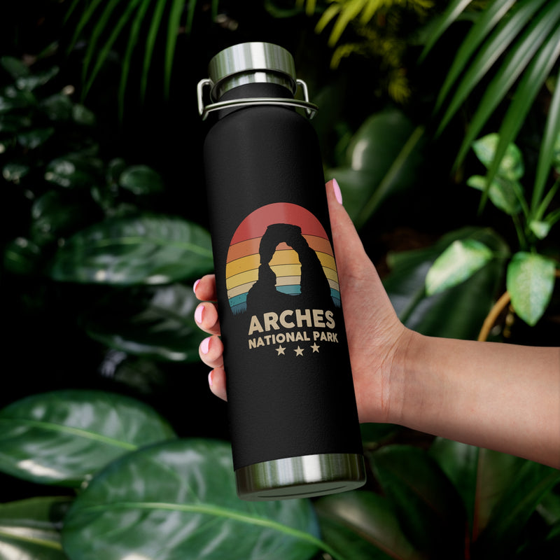 Image of a stainless steel water bottle featuring a design from Arches National Park.