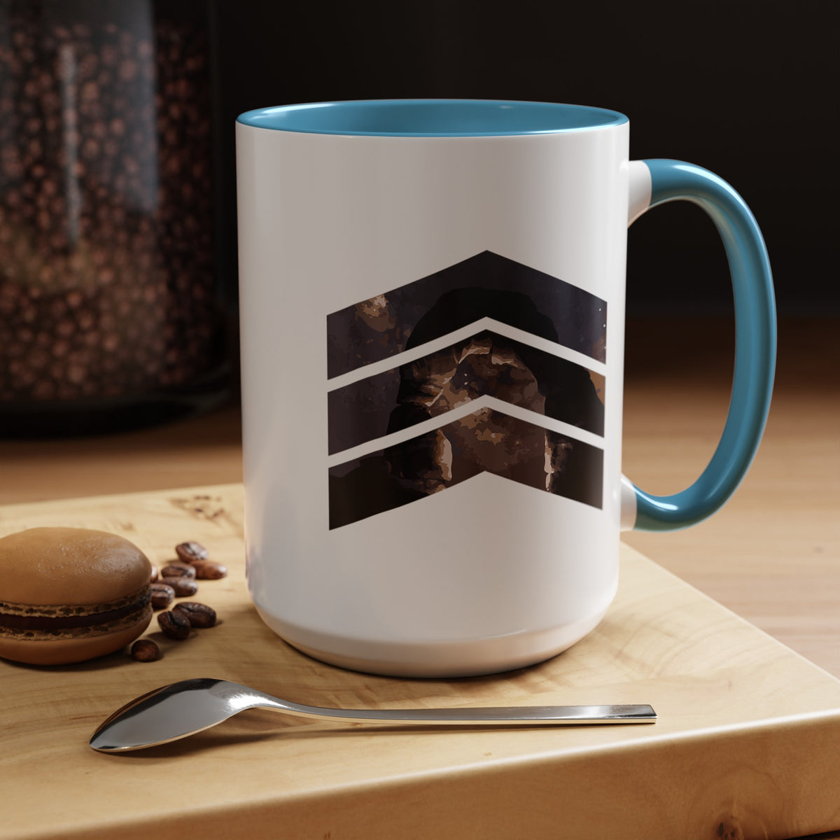 15 oz ceramic mug with light blue handle featuring a mountain design with three chevrons, representing Arches National Park.