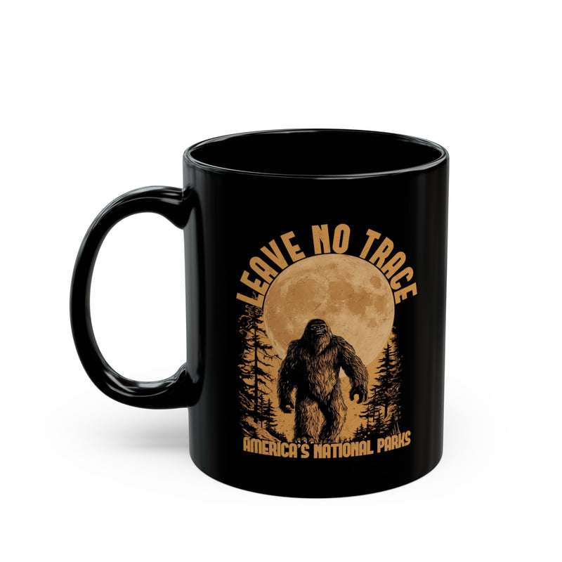 Bigfoot souvenir mug with "Leave No Trace" text and Michigan's National Park scene in the background.