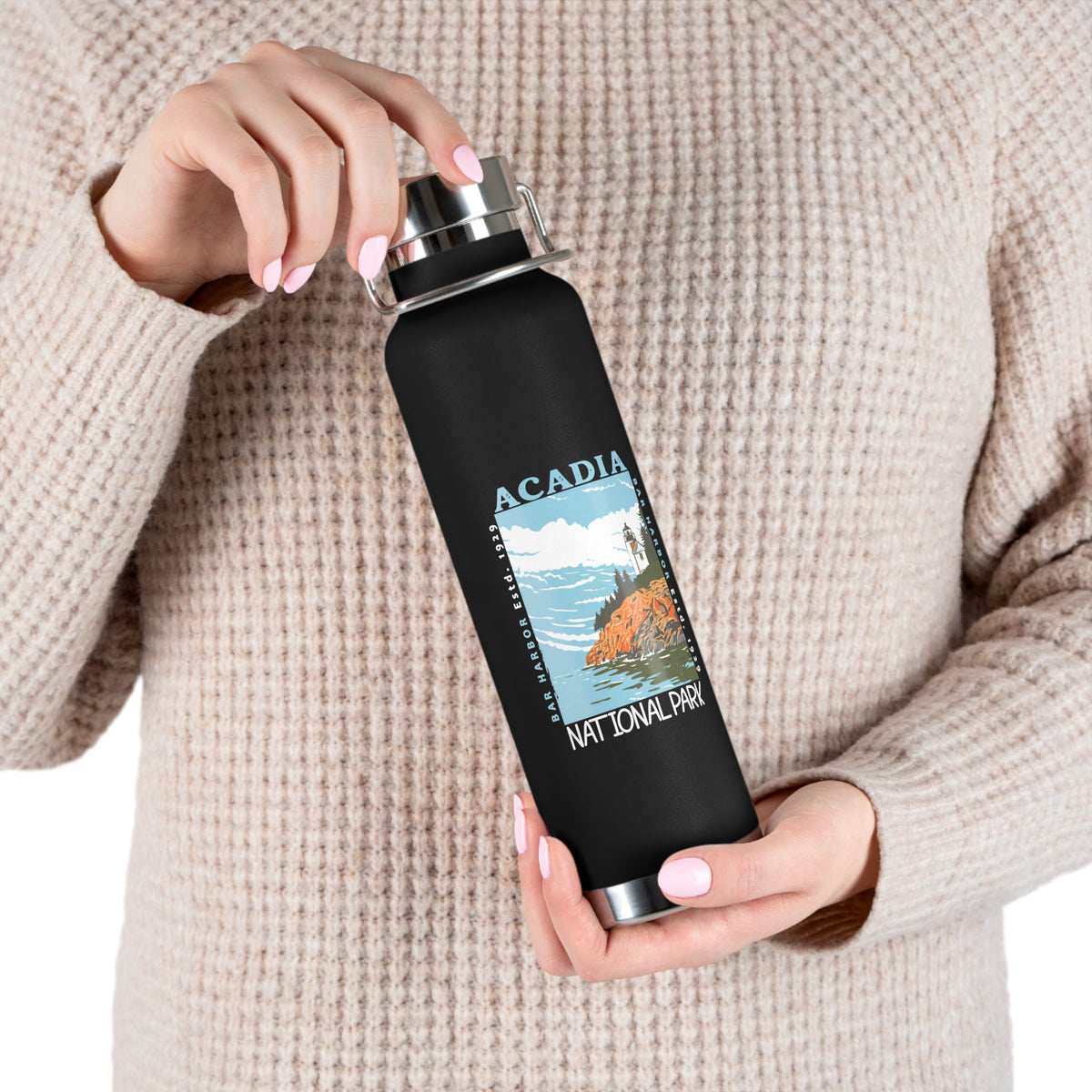 Stainless steel water bottle featuring an Acadia National Park design with a lighthouse and coastal illustration, durable powder-coated finish.