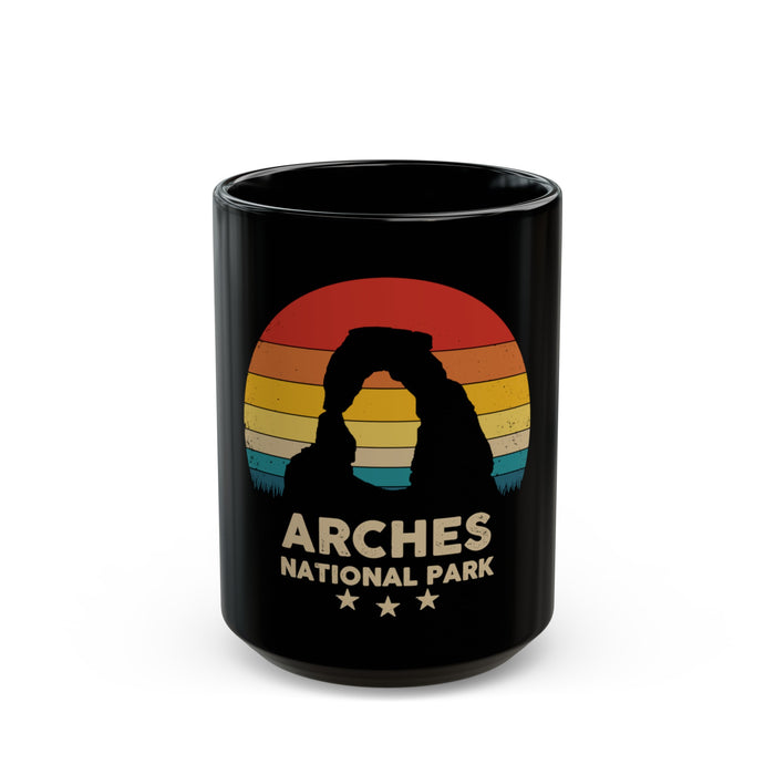 Ceramic mug featuring a sunset silhouette design of Arches National Park, perfect as a souvenir.