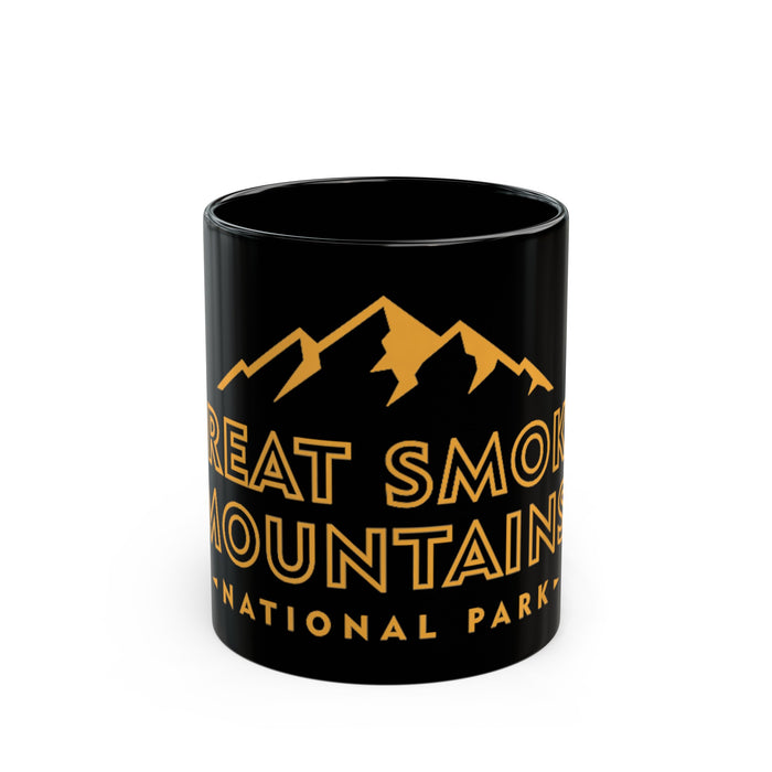 Ceramic mug featuring an illustration of Great Smoky Mountains National Park with mountain peaks and text.