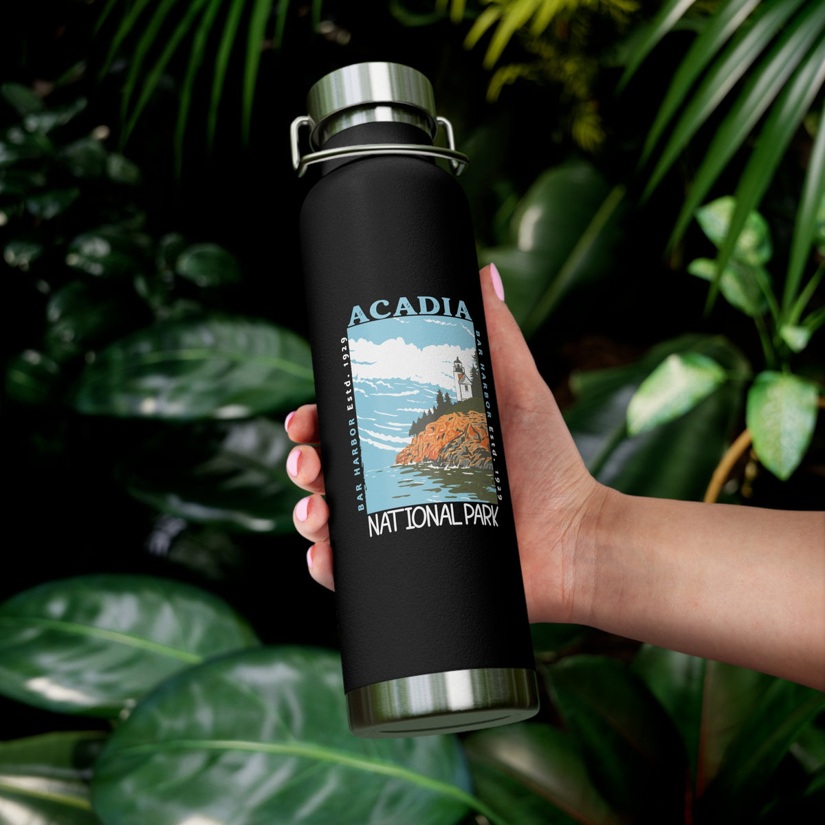 Stainless steel water bottle featuring an Acadia National Park design with a lighthouse and coastal illustration, durable powder-coated finish.