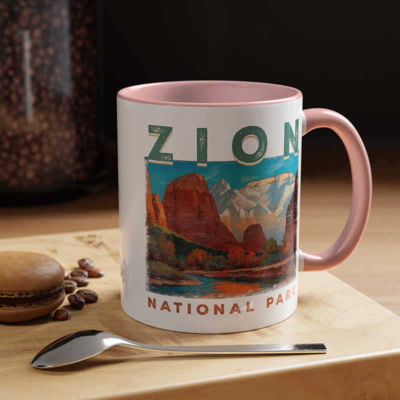 White ceramic mug with a contrasting handle and interior, featuring a scenic landscape design of Zion National Park.