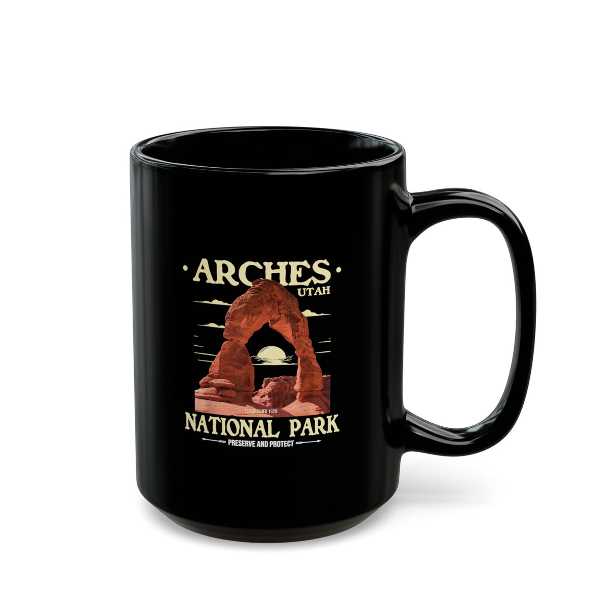 Black ceramic coffee mug featuring a detailed design of Arches National Park in Utah, perfect for coffee or tea lovers.