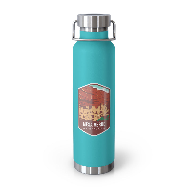 Mint green stainless steel water bottle with a scenic design of Mesa Verde National Park.