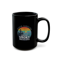 Ceramic mug featuring an illustration of Great Smoky Mountains National Park with a sunset, trees, and North Carolina text.