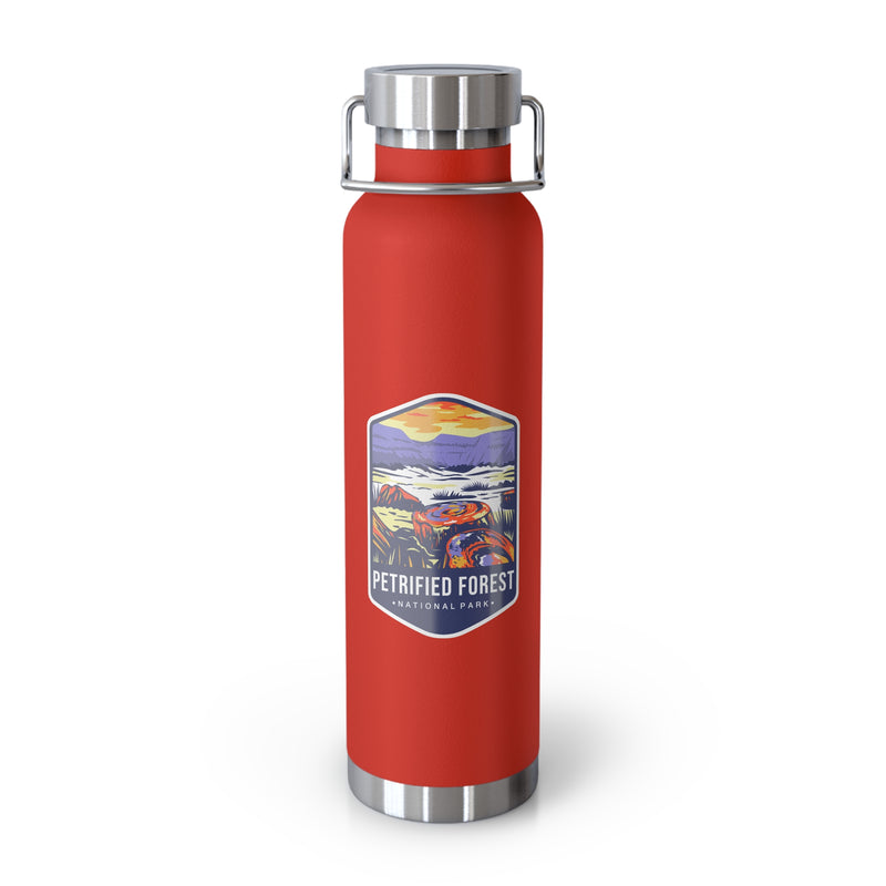 Red stainless steel water bottle featuring a colorful design of Petrified Forest National Park with scenic landscapes.