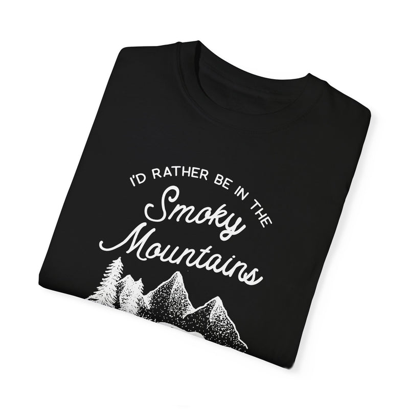 A T-shirt featuring a design with a bear, trees, and mountains, and text reading "I'd Rather Be in the Smoky Mountains."