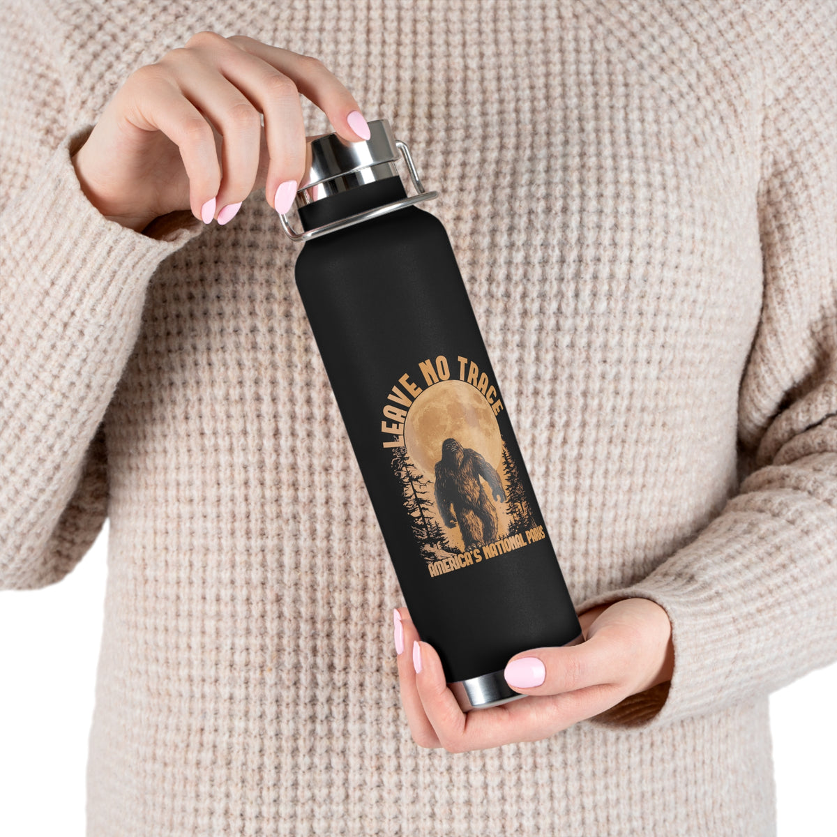 Water bottle with Leave No Trace design featuring a bear silhouette and full moon, promoting conservation in America's national parks.