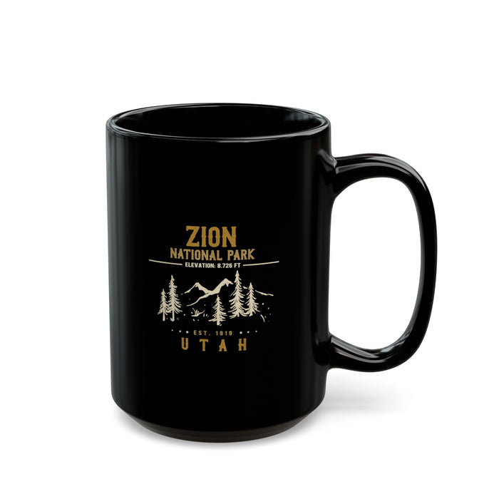 Black ceramic mug featuring a design of Zion National Park with mountains, trees, and elevation details.