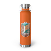 Orange stainless steel water bottle featuring a design of Yellowstone National Park with a waterfall and canyon scenery.