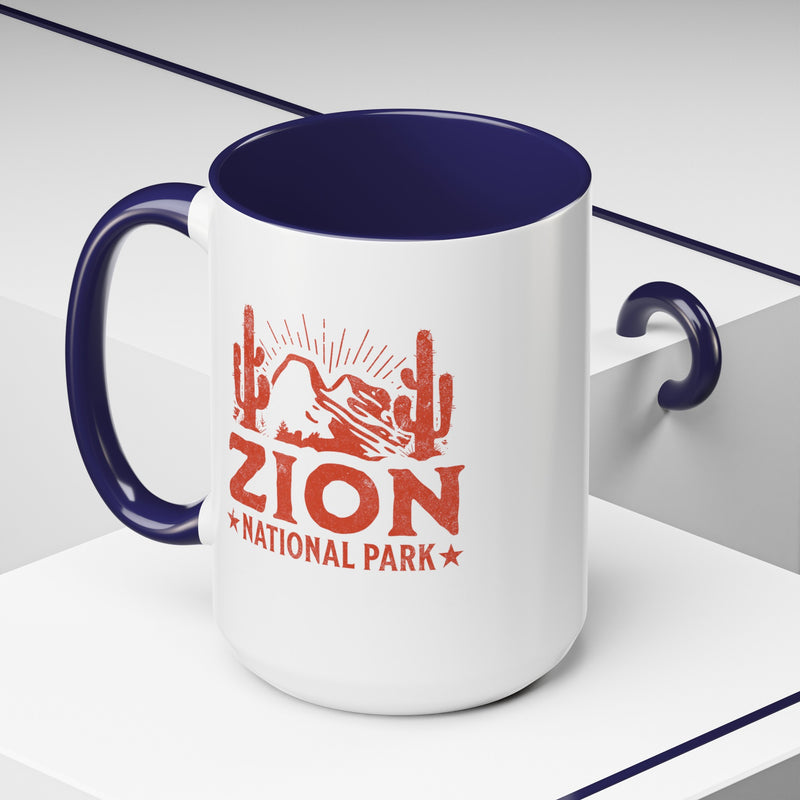 15 oz ceramic mug with navy contrasting handle featuring a cactus design of Zion National Park, perfect as a souvenir.