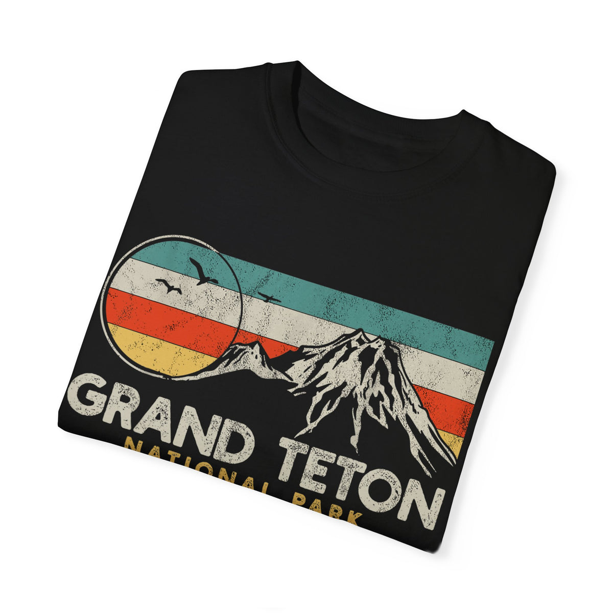 Grand Teton National Park T-shirt featuring a retro mountain graphic design with colorful stripes.