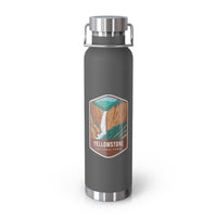 Grey stainless steel water bottle featuring a design of Yellowstone National Park with a waterfall and canyon scenery.