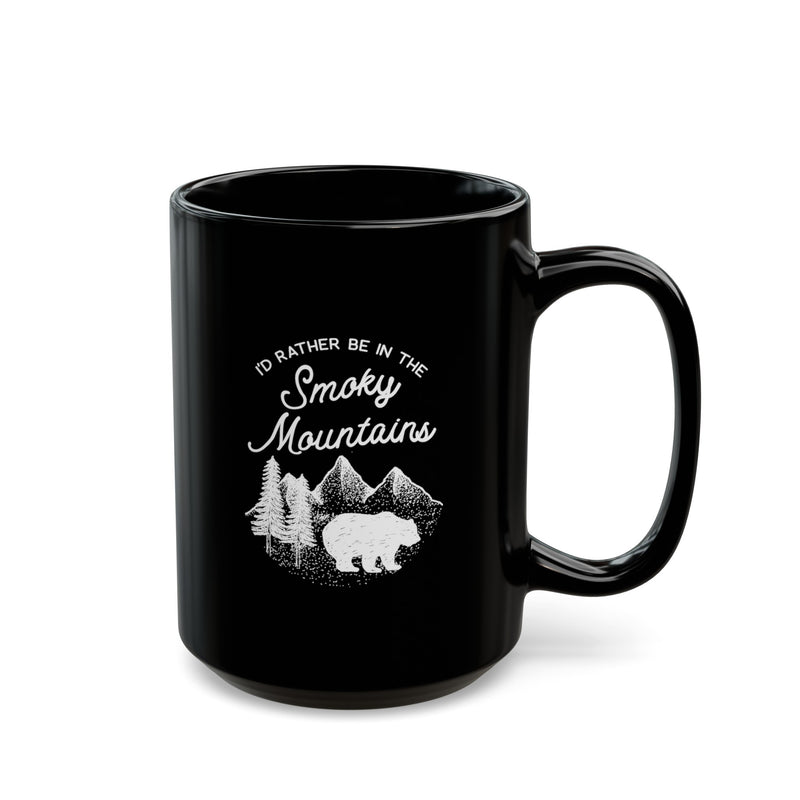 Black ceramic mug featuring a design with a bear and mountains, and the text "I'd rather be in the Smoky Mountains."