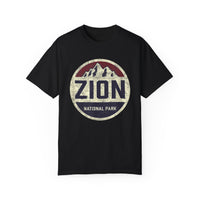 Vintage-style t-shirt with a circular design featuring the text "Zion National Park" and mountain graphics.