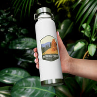 White stainless steel water bottle featuring a Petrified Forest National Park design with a tall petrified tree.