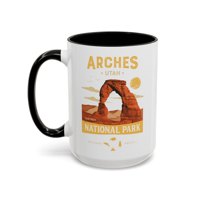 White 15 oz ceramic coffee mug with a black handle, featuring a detailed design of Arches National Park, Utah. Perfect for coffee or tea lovers.