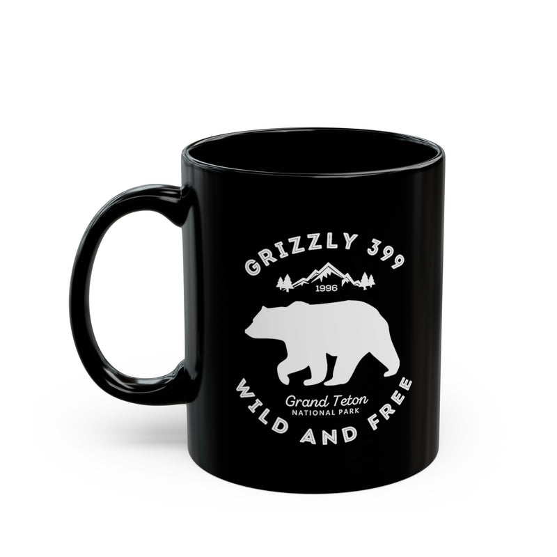 Grand Teton National Park souvenir mug featuring a Grizzly 399 design with "Wild and Free" text.