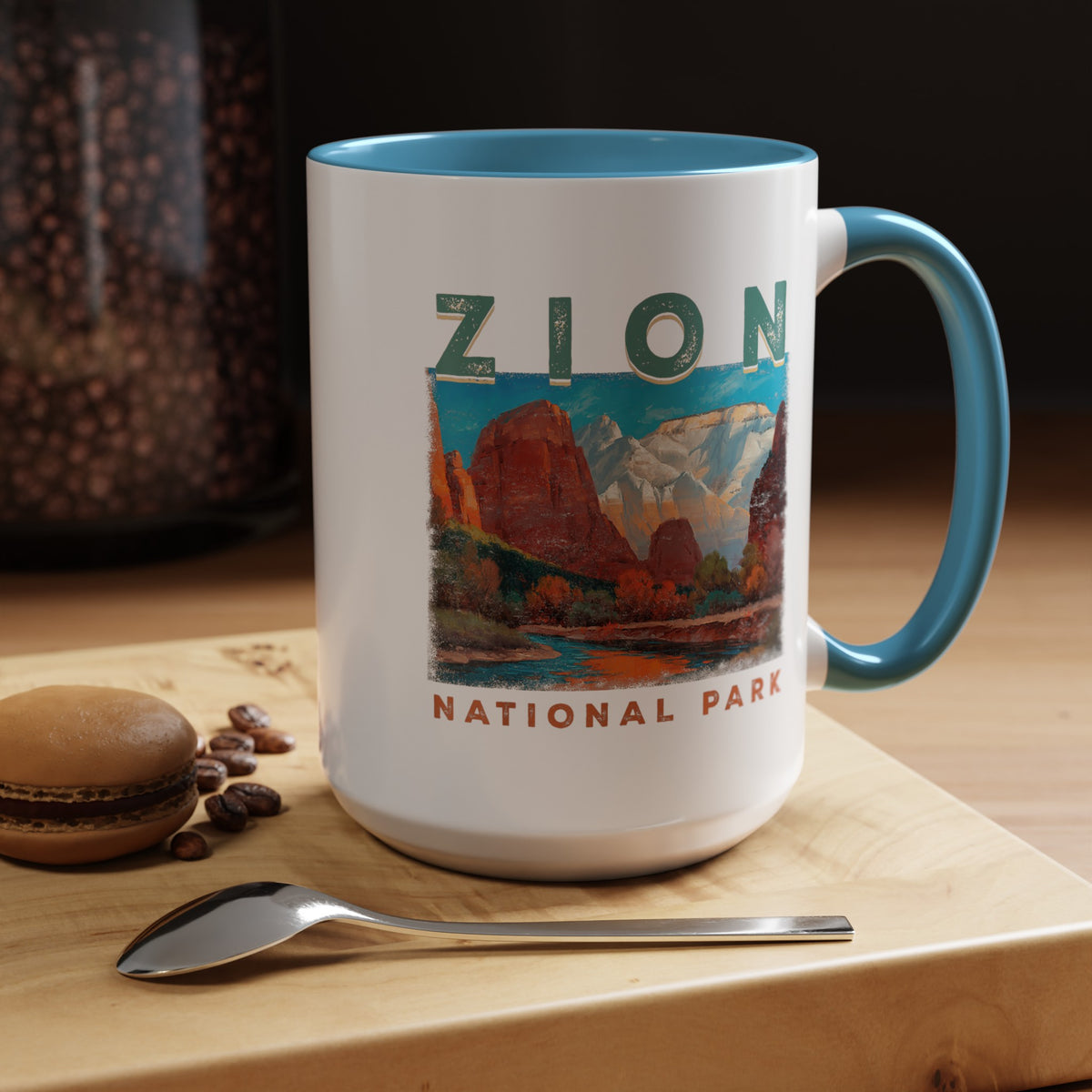 White ceramic mug with a contrasting handle and interior, featuring a scenic landscape design of Zion National Park.