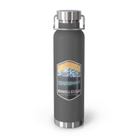 Grey stainless steel water bottle featuring a design of Wrangell-St. Elias National Park with mountain and sunset scenery.