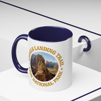 White ceramic mug with a contrasting handle and interior, featuring an image of Angels Landing Trail in Zion National Park with a mountain landscape design.