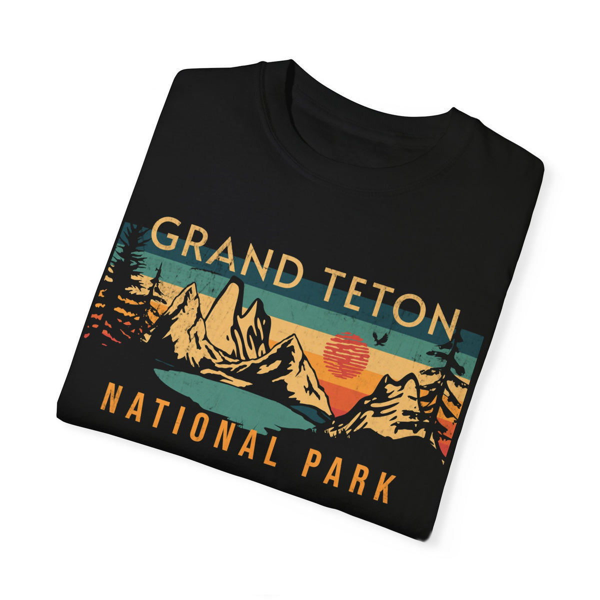 Grand Teton National Park T-shirt featuring a scenic sunset graphic design with mountains and trees.