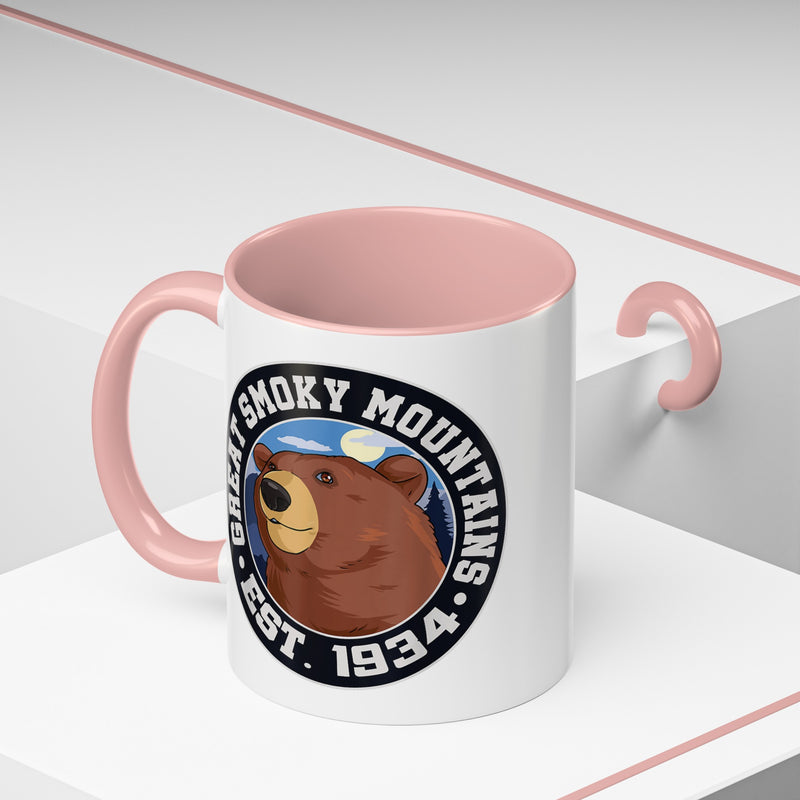 11 oz pink ceramic mug featuring an illustration of a bear with the text "Great Smoky Mountains Est. 1934."