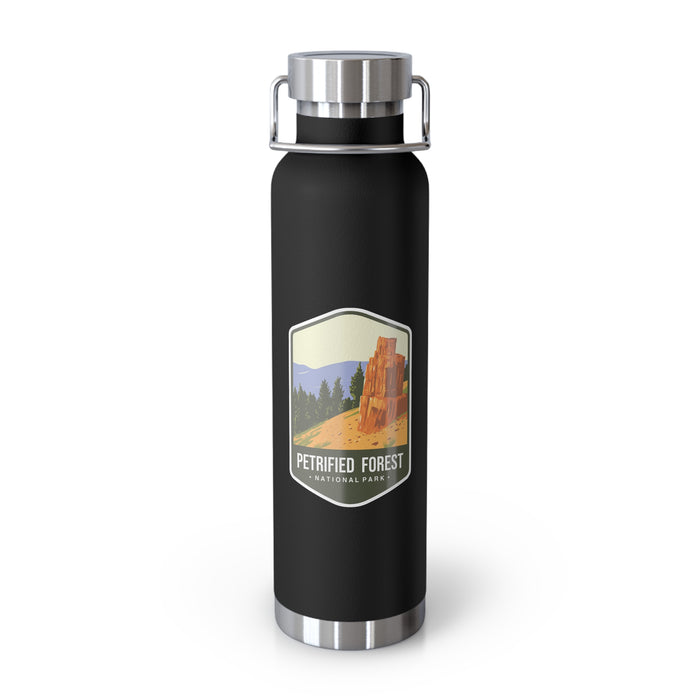 Black stainless steel water bottle featuring a Petrified Forest National Park design with a tall petrified tree.