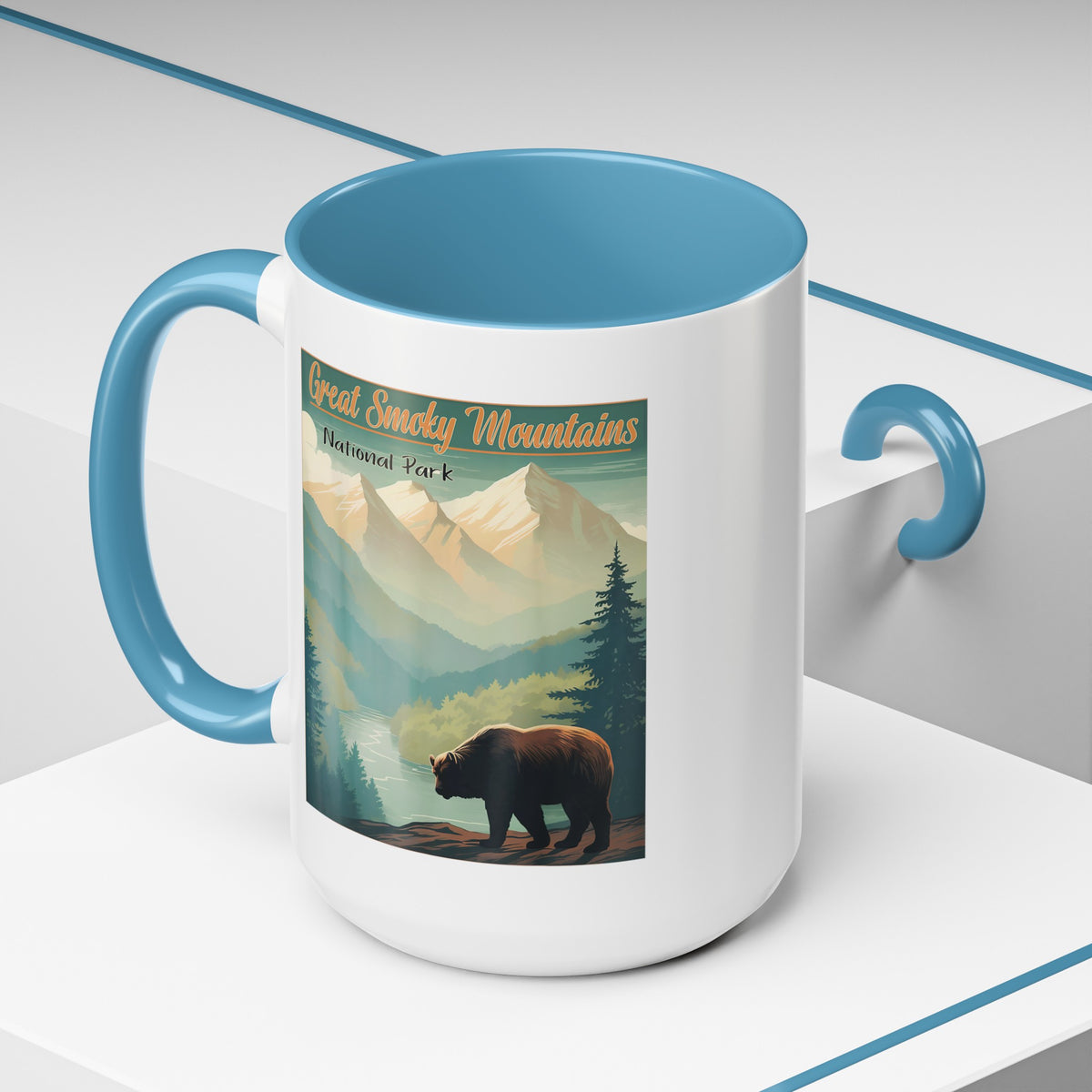 15 oz light blue ceramic mug featuring an illustration of a bear in Great Smoky Mountains National Park with mountains and trees in the background.